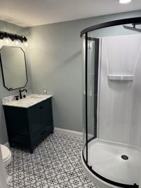 Renovated bathroom with patterned floor