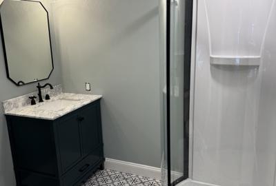 Renovated bathroom with patterned floor